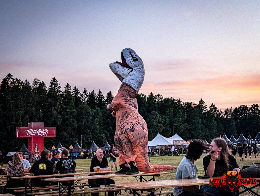 Dinosaur having a blast at Tons of Rock 2026