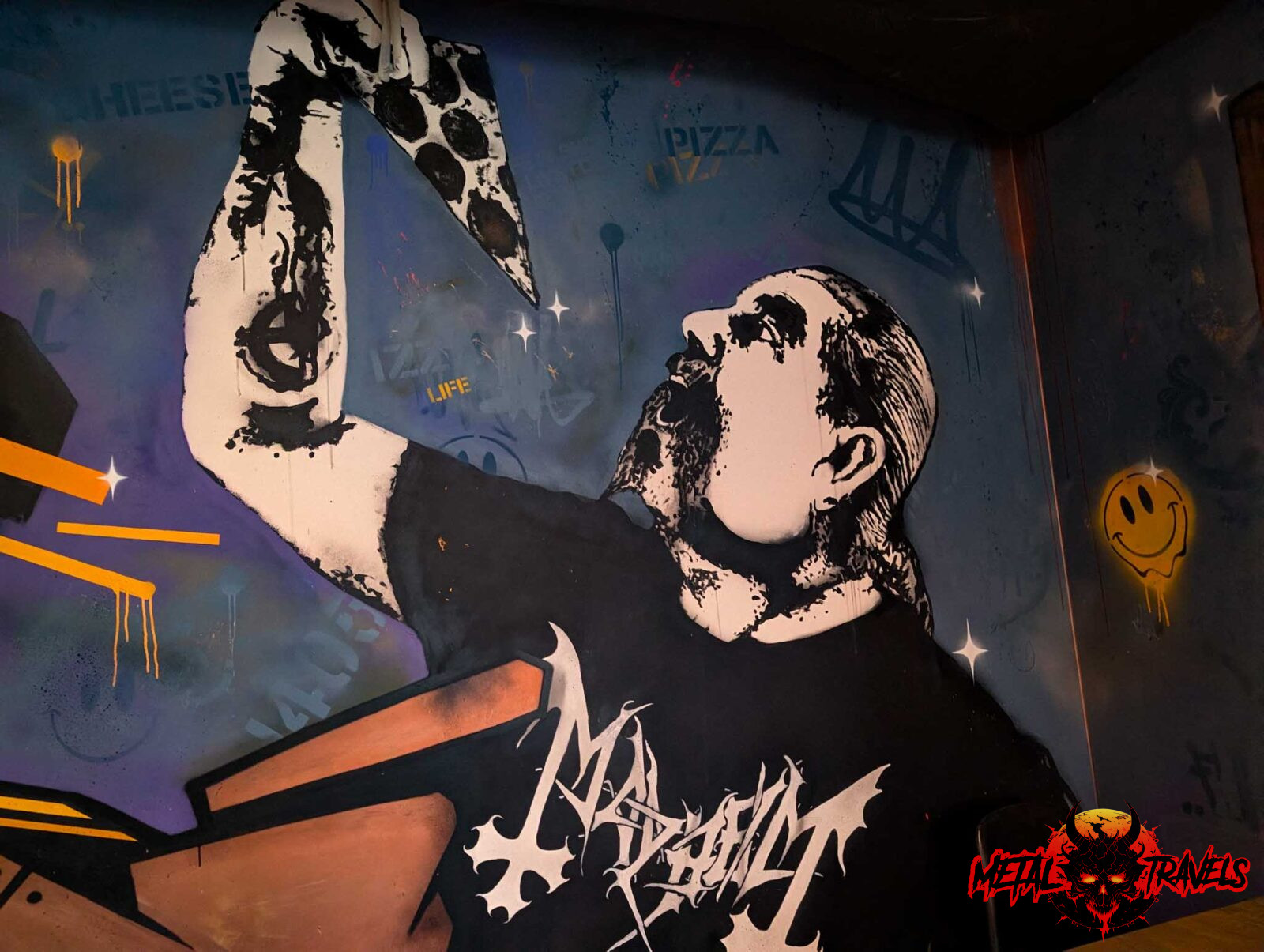 Pizzeria-Melvin-01 Man eating pizza with Mayhem Shirt Wall art at Pizzeria Melvin